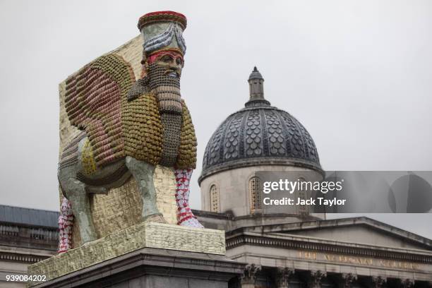 The new fourth plinth sculpture titled 'The Invisible Enemy Should Not Exist' by Iraqi American artist Michael Rakowitz is unveiled in Trafalgar...