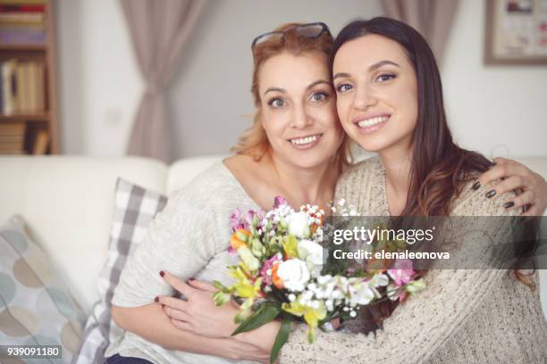 mom and daughter with flowers - 2016 243 stock pictures, royalty-free photos & images