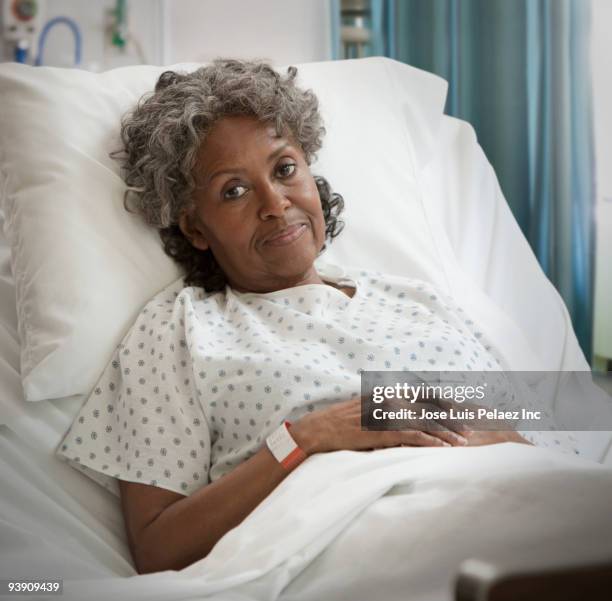 african hospital patient frowning - hospital gown stock pictures, royalty-free photos & images