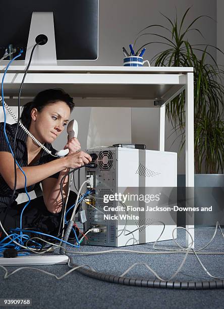 a female angrily fixing her computer - businesswoman under stock pictures, royalty-free photos & images