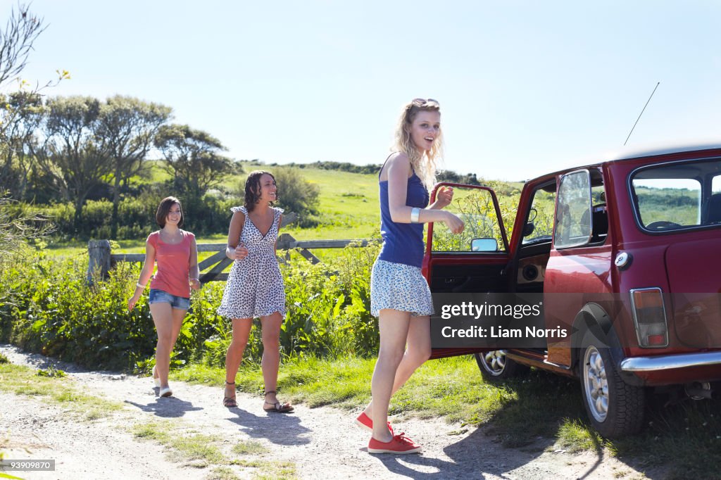 Friends walking to a car