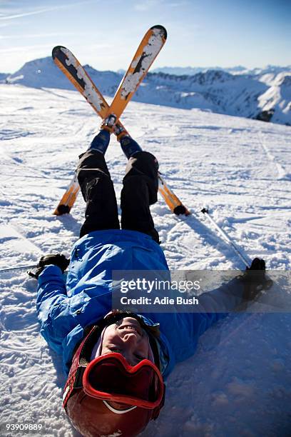 child on skis lying in the snow. - mount disappointment stock pictures, royalty-free photos & images