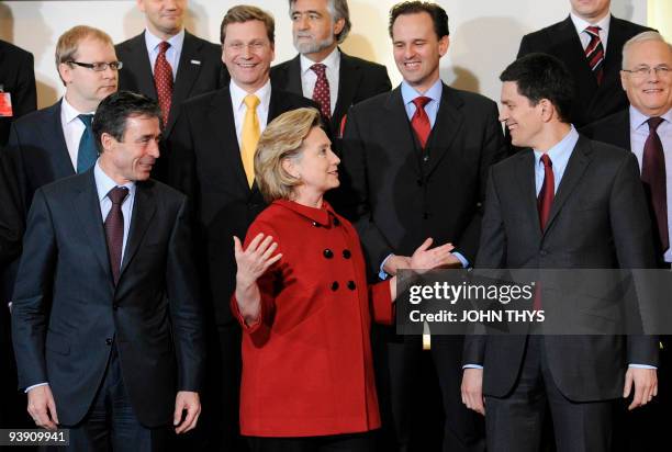 Secretary of State Hillary Clinton speaks with Britain's foreign secretary David Miliband and NATO Secretary General Anders Fogh Rasmussen German...