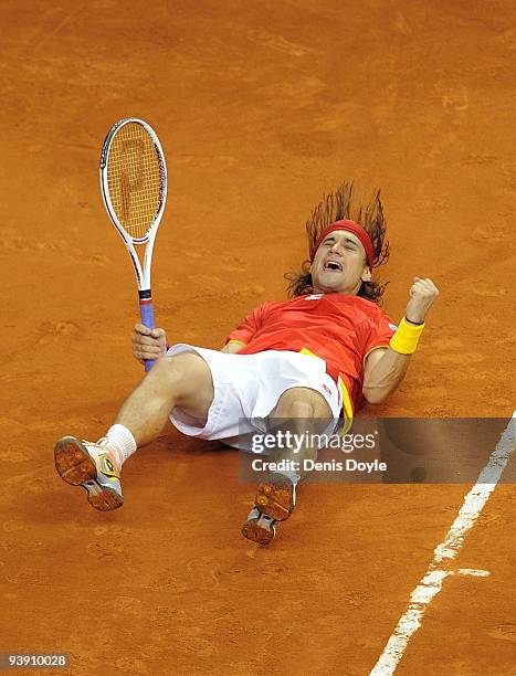 David Ferrer of Spain celebrates after beating Radek Stepanek of Czech Republic in the second match of the Davis Cup final at the Palau Sant Jordi...