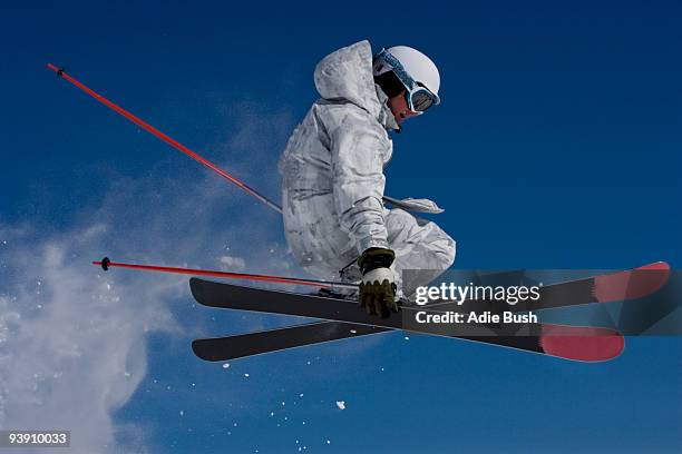 man in white & grey camo suit grabbing. - bush live stockfoto's en -beelden