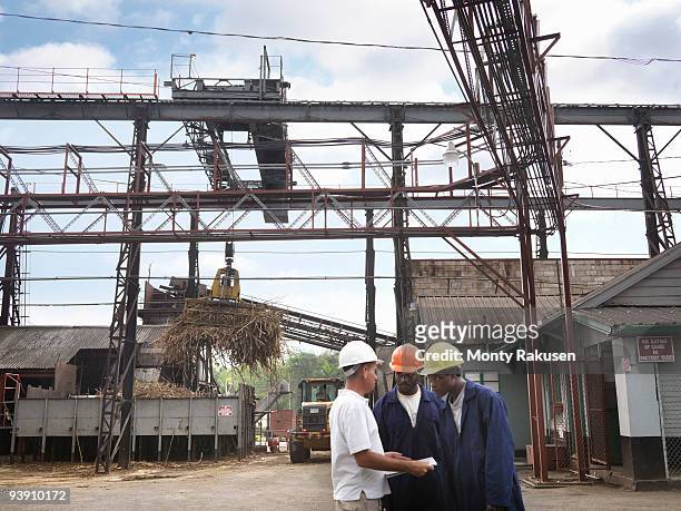 sugar cane workers at processing plant - agriculture sugar cane stock pictures, royalty-free photos & images