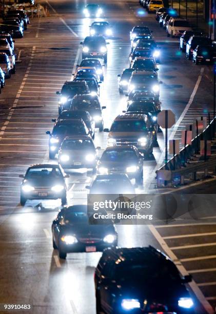 Traffic travels across the Robert F. Kennedy Bridge, formerly the Triborough Bridge, as seen from Queens, New York, U.S., on Thursday, Dec. 3, 2009....