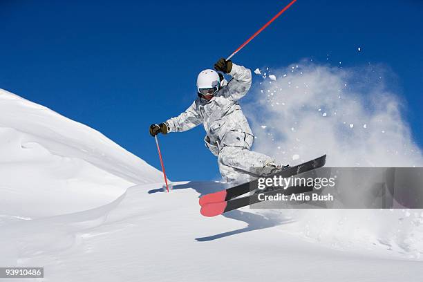 man in white & grey camo suit off-piste. - alpine skiing stock pictures, royalty-free photos & images