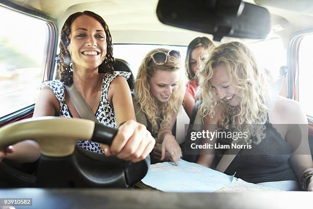 friends packing a car - four people in car stock pictures, royalty-free photos & images