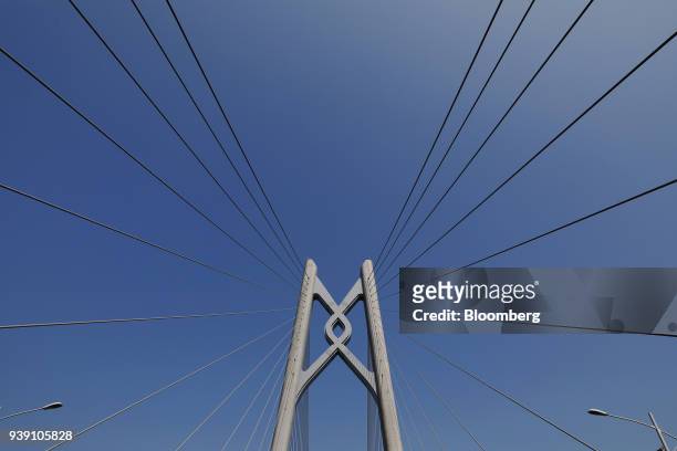 Bridge stanchion stands on a section of the Hong Kong-Zhuhai-Macau Bridge during a media tour of the bridge offshore in Zhuhai, China, on Wednesday,...
