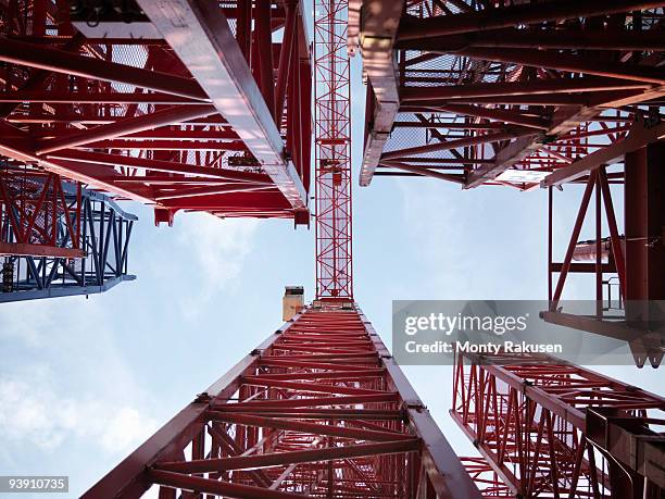 tower cranes from below - underside stock pictures, royalty-free photos & images