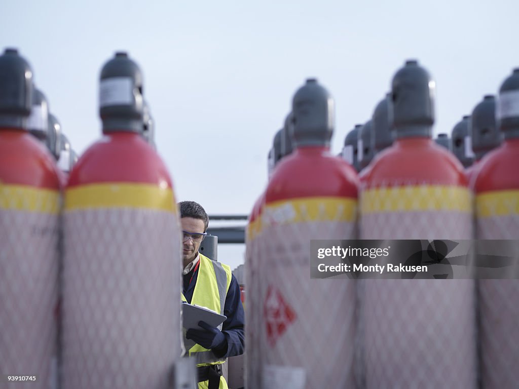 Port Worker With Gas Canisters