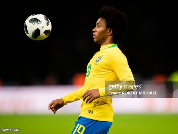 Brazil's midfielder Willian plays the ball during the international friendly football match between Germany and Brazil in Berlin, on March 27, 2018....