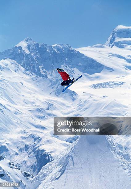 freestyle skier jumping into the air - ross woodhall stock-fotos und bilder