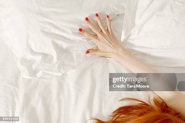 hand outstretched on bed - want stock pictures, royalty-free photos & images