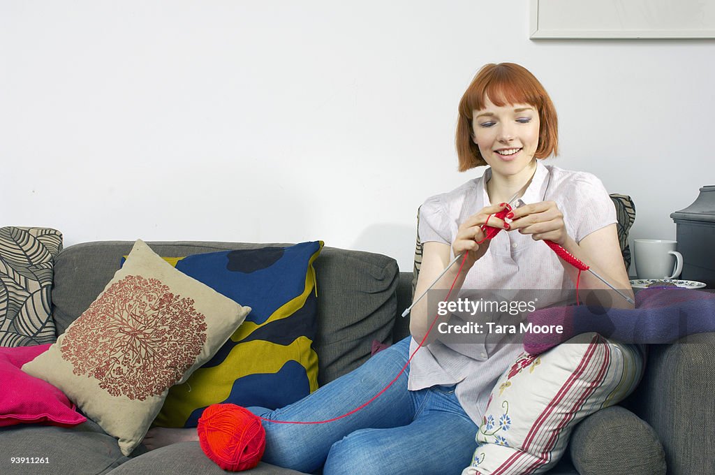 Woman on sofa knitting