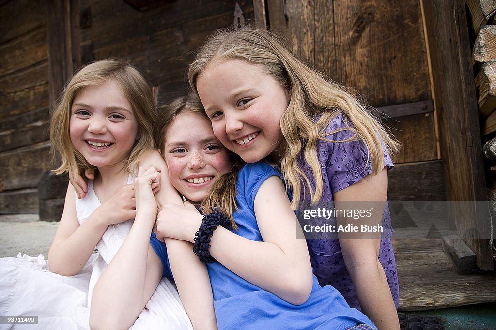 Three girls smiling.