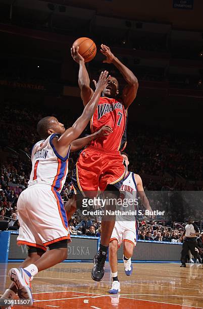 Kelenna Azubuike of the Golden State Warriors shoots against Chris Duhon of the New York Knicks during the game on November 13, 2009 at Madison...
