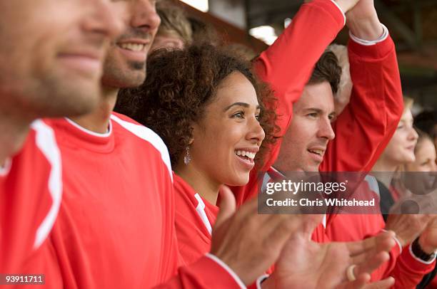 fans clapping at football match - female football fans stock pictures, royalty-free photos & images