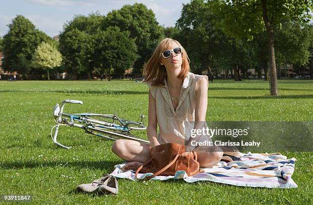 woman sitting in park - hackney weekend stock pictures, royalty-free photos & images