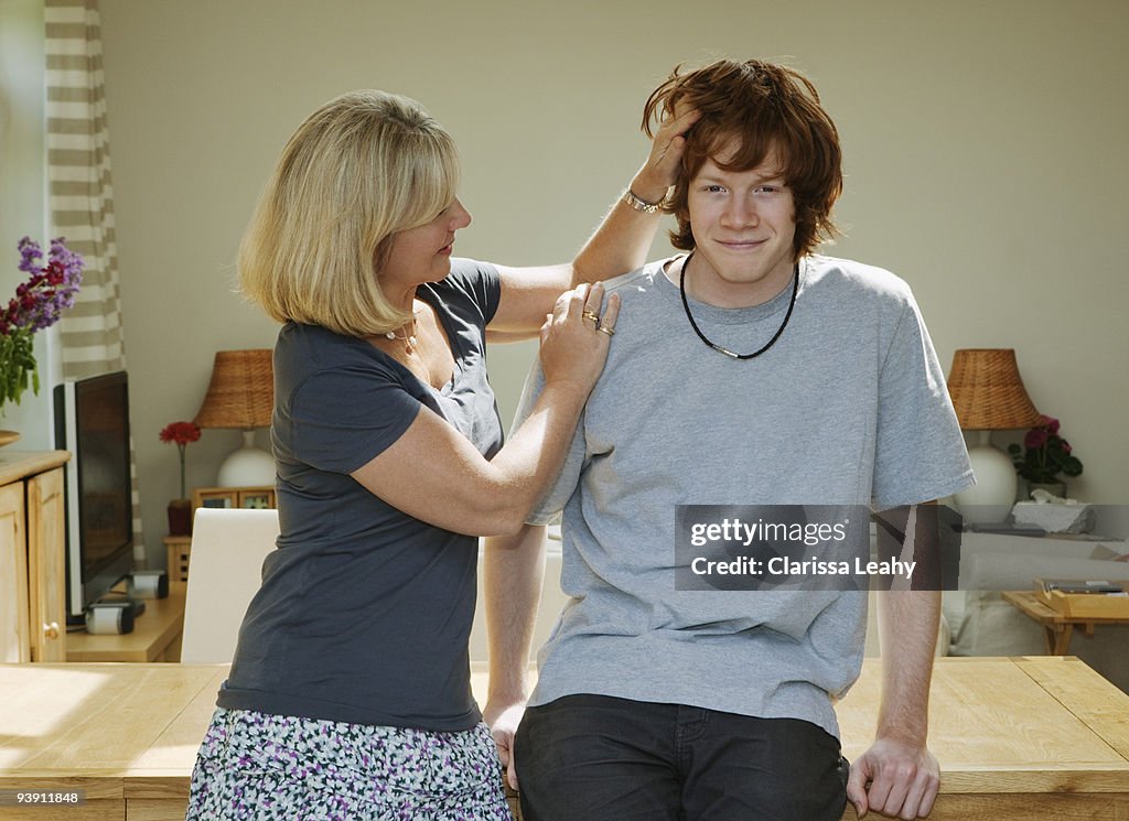 Mother stroking sons head