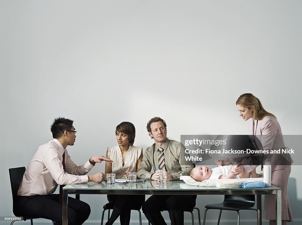 Changing baby's nappy in a meeting