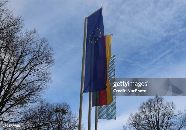 The flag of the European Union , the flag of the Federal Republic of Germany and the flag of the Free State of Bavaria are seen in front of the...