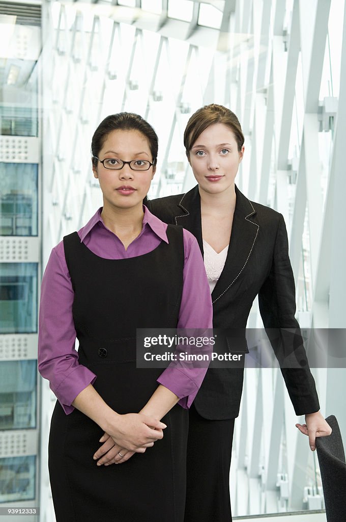 Portrait of two business women.