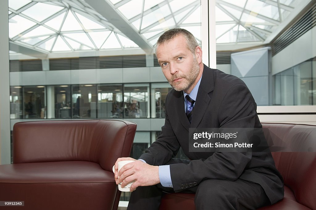 A seated senior business man