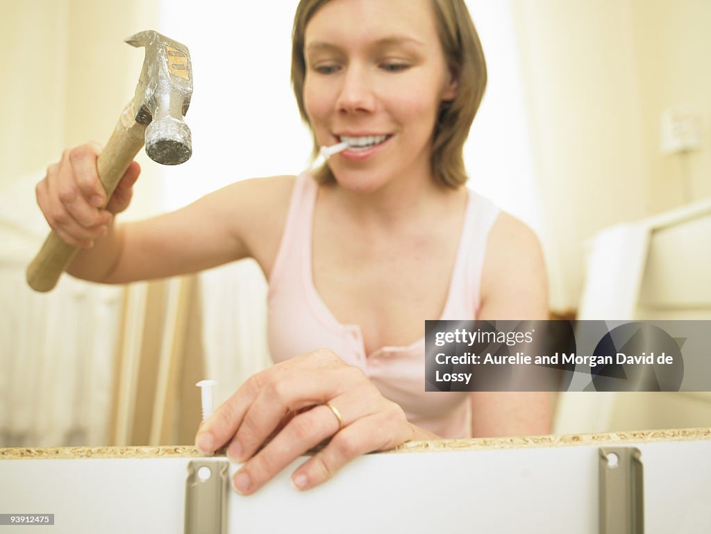 Woman building furniture
