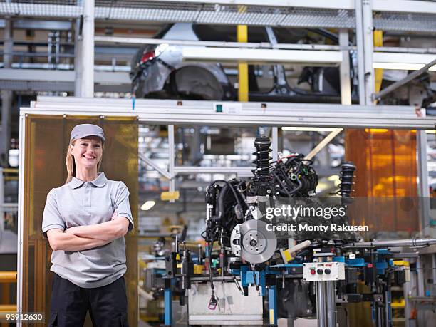 female car worker with car parts - auto stehend stock-fotos und bilder