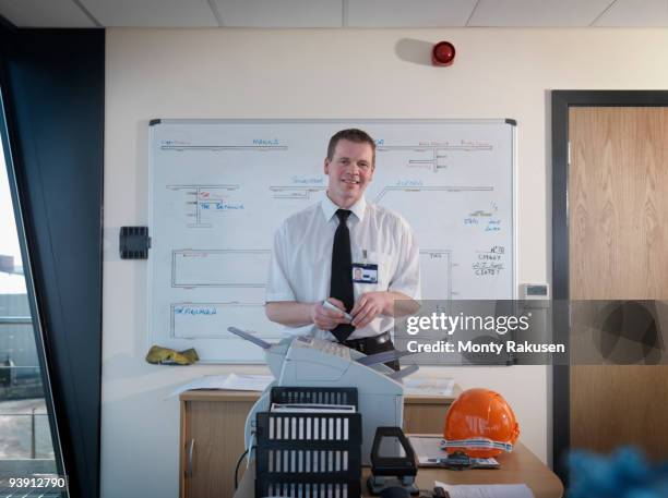 port worker in control tower office - airport authority stock pictures, royalty-free photos & images