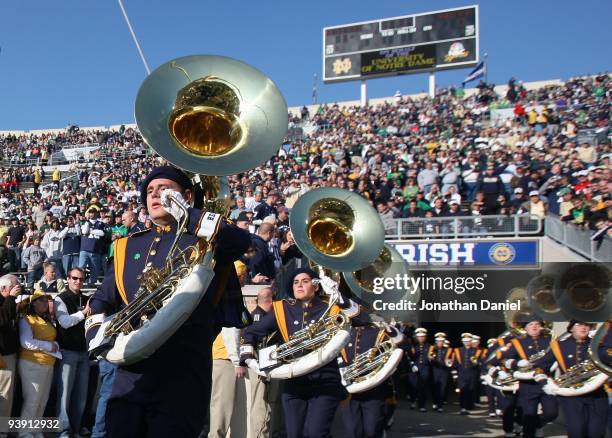 The marching band of the Notre Dame Fighting Irish enters the field before the game against the Univeristy of Connecticut Huskies at Notre Dame...