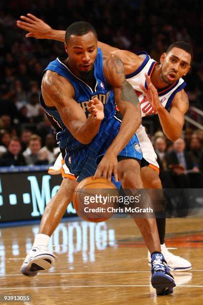 Rashard Lewis of the Orlando Magic drives past Jared Jefferies of the New York Knicks at Madison Square Garden November 29, 2009 in New York City....