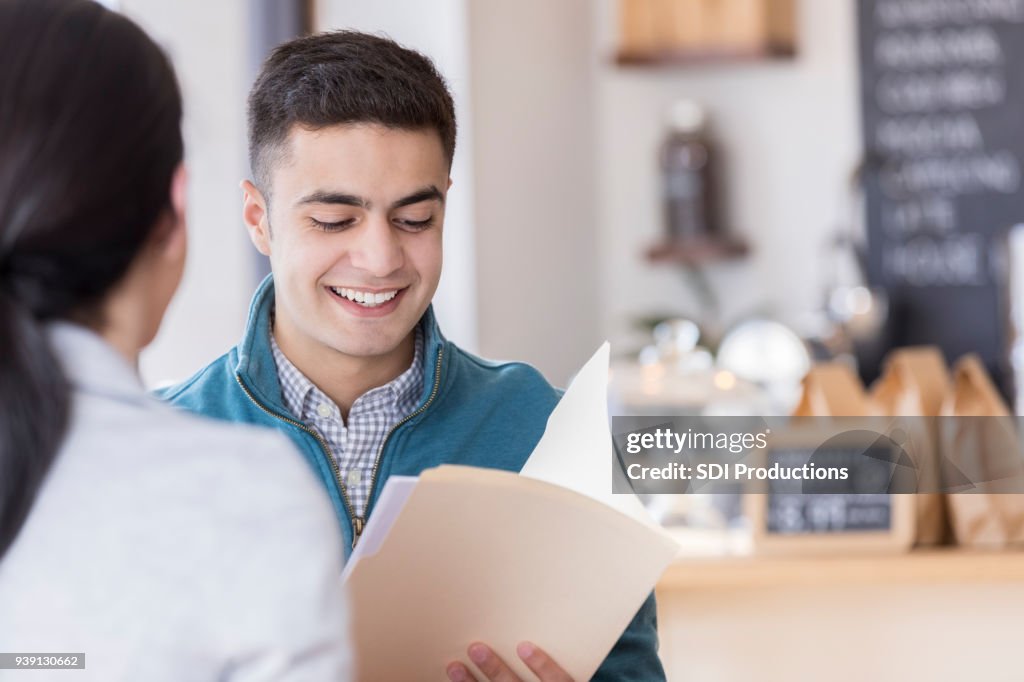 Business colleagues meet for coffee before work