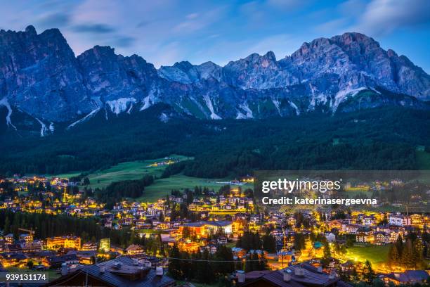 cortina d'ampezzo. itaiy. night city in the mountains - cortina stock pictures, royalty-free photos & images