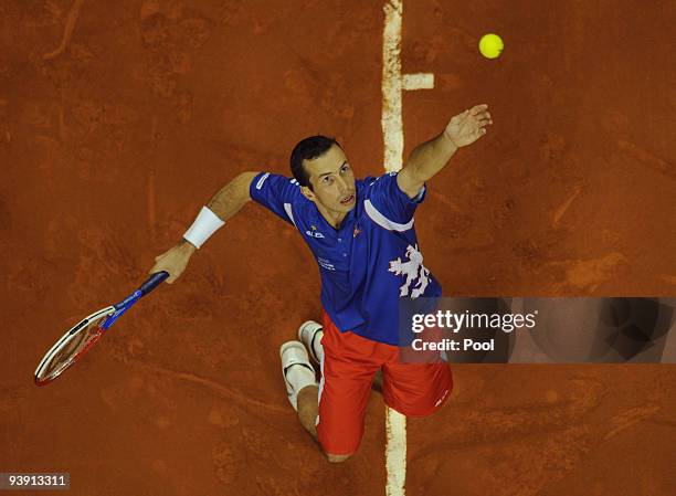 Radek Stepanek of Czech Republic serves to David Ferrer of Spain during the second match of the Davis Cup final at the Palau Sant Jordi stadium on...