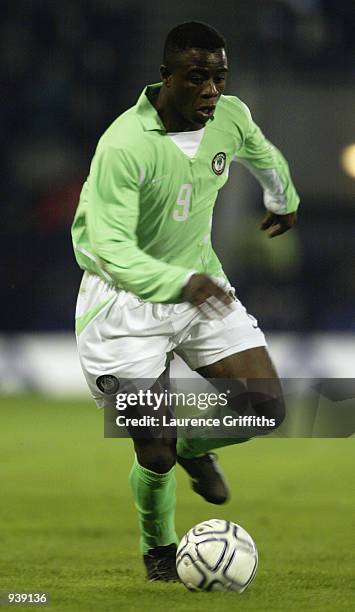 Bartholomew Ogbeche of Nigeria runs with the ball during the International Friendly match between Scotland and Nigeria played at the Pittodrie...