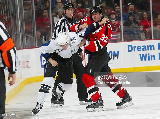 James Wright of the Tampa Bay Lightning and Mathew Corrente of the New Jersey Devils exchange punches during their game at the Prudential Center on...