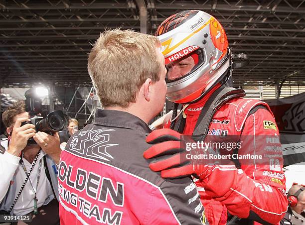 Garth Tander driver of the Holden Racing Team Holden celebrates after taking pole position for race 25 of the Sydney 500 Grand Finale, which is round...