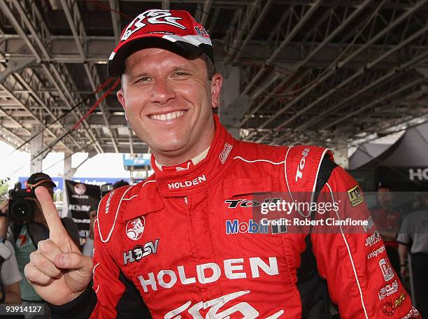 Garth Tander driver of the Holden Racing Team Holden celebrates after taking pole position for race 25 of the Sydney 500 Grand Finale, which is round...