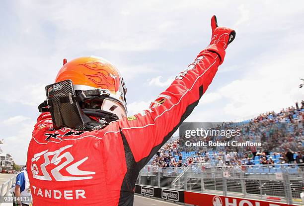 Garth Tander driver of the Holden Racing Team Holden celebrates after taking pole position for race 25 of the Sydney 500 Grand Finale, which is round...