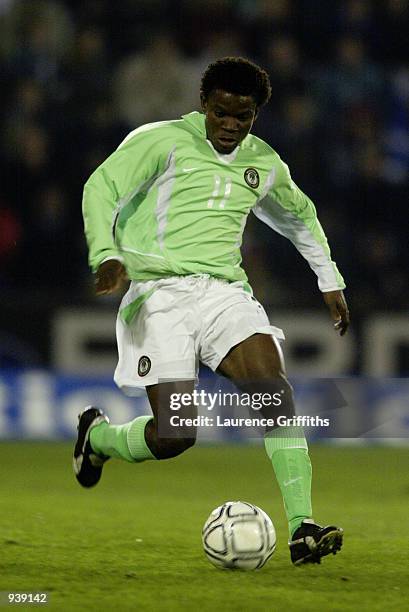 Pius Ikedia of Nigeria runs with the ball during the International Friendly match between Scotland and Nigeria played at the Pittodrie Stadium, in...