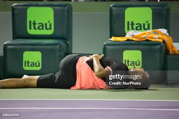 Nick Kyrgios, from Australia, doing some self-massages during one of the change over during his match against Alexander Zverev, from Germany, Miami...