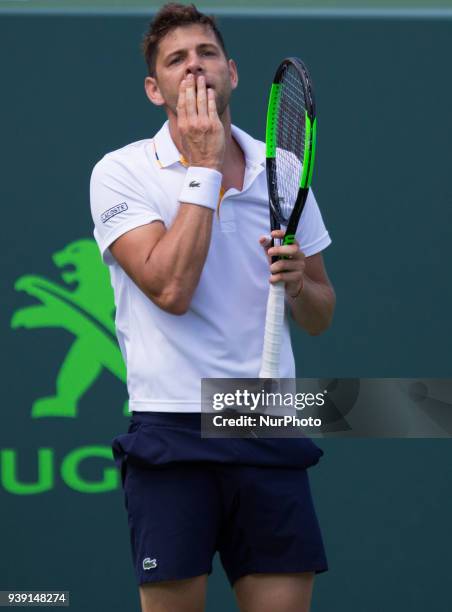 Filip Krajinovic, from Serbia, reacts after losing a point against Juan Martin Del Potro, from Argentina, during his fourth round match at the Miami...