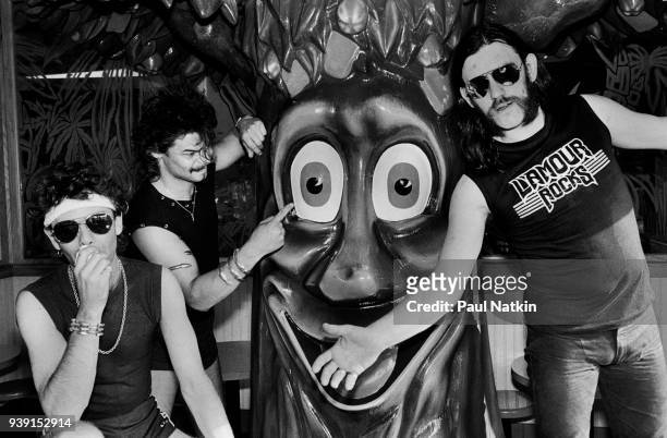 Portrait of the British metal band Motorhead at a McDonald's restaurant in Chicago, Illinois, August 5, 1983. Left to right, Brian Robertson, Phil...