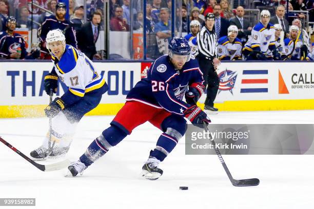 Thomas Vanek of the Columbus Blue Jackets skates the puck away from Jaden Schwartz of the St. Louis Blues during the game on March 24, 2018 at...