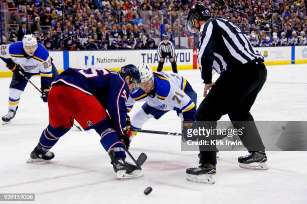 Mark Letestu of the Columbus Blue Jackets beats Vladimir Sobotka of the St. Louis Blues for a face-off win during the game on March 24, 2018 at...
