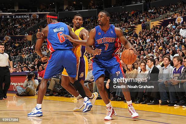 Ben Gordon of the Detroit Pistons moves around a screen set by teammate Ben Wallace on Ron Artest of the Los Angeles Lakers during the game at...