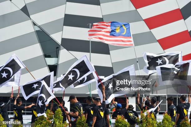 Malaysian and Terengganu flags seen in Rembau center. On Saturday, March 24 in Nilai, Malaysia.